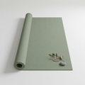 Sage green yoga mat on white background